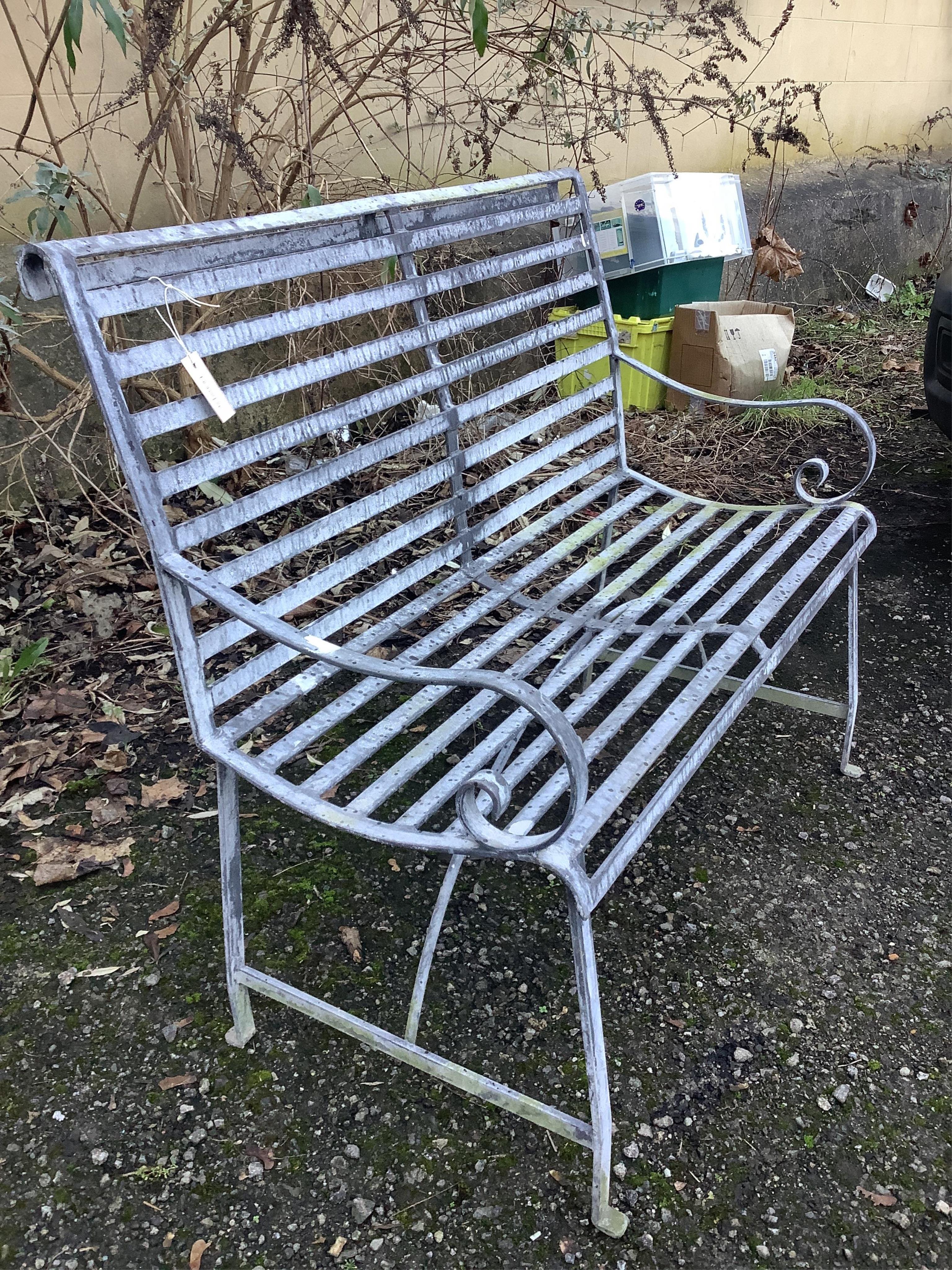 A 19th century style slatted wrought iron garden bench, width 107cm, depth 42cm, height 94cm. Condition - fair to good